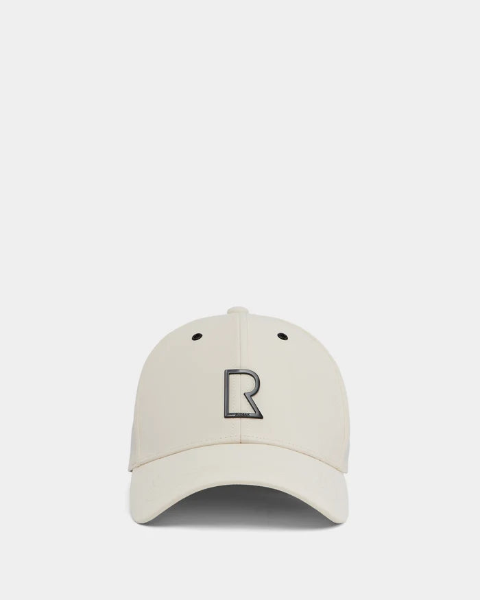 The Rudsak ARSENE - 9422504 Iceland unisex baseball cap in beige features a curved brim and a bold black-outlined R logo on the front, shown against a plain white background.