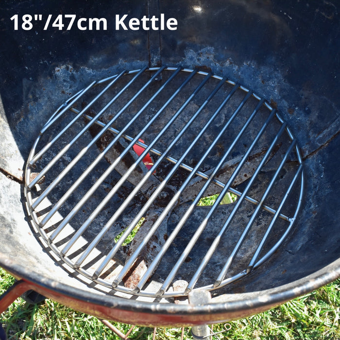 47cm charcoal grate fitted to a red weber kettle grass background