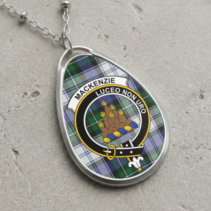 Mackenzie clan Scottish tartan necklace with clan crest and Luceo Non Uro motto on tartan background