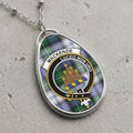 Mackenzie clan Scottish tartan necklace with clan crest and Luceo Non Uro motto on tartan background