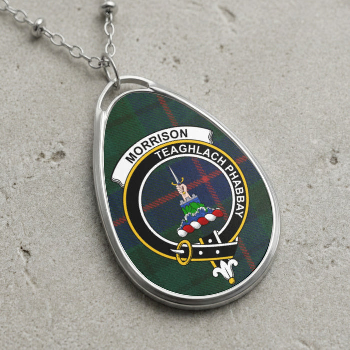 Morrison clan Scottish tartan necklace with clan crest and Teaghlach Phabbay motto on tartan background