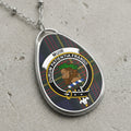 Muir clan Scottish tartan necklace with clan crest and Durum Patientia Frango motto on tartan background