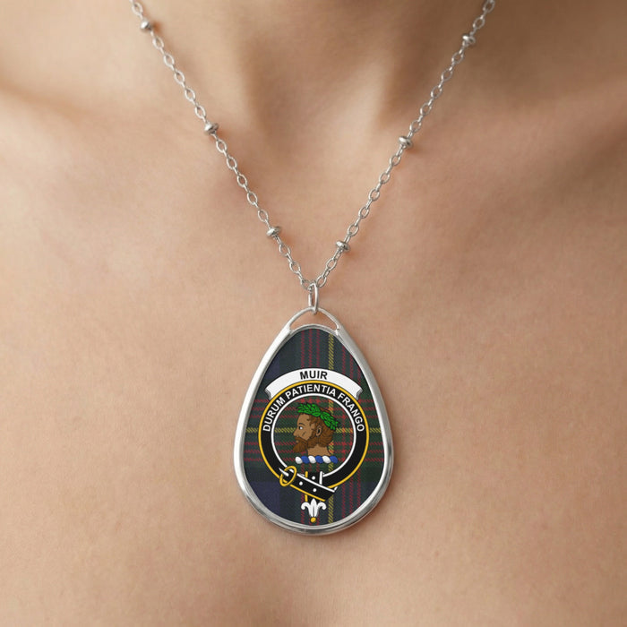Close-up of Muir clan tartan pendant necklace with crest design