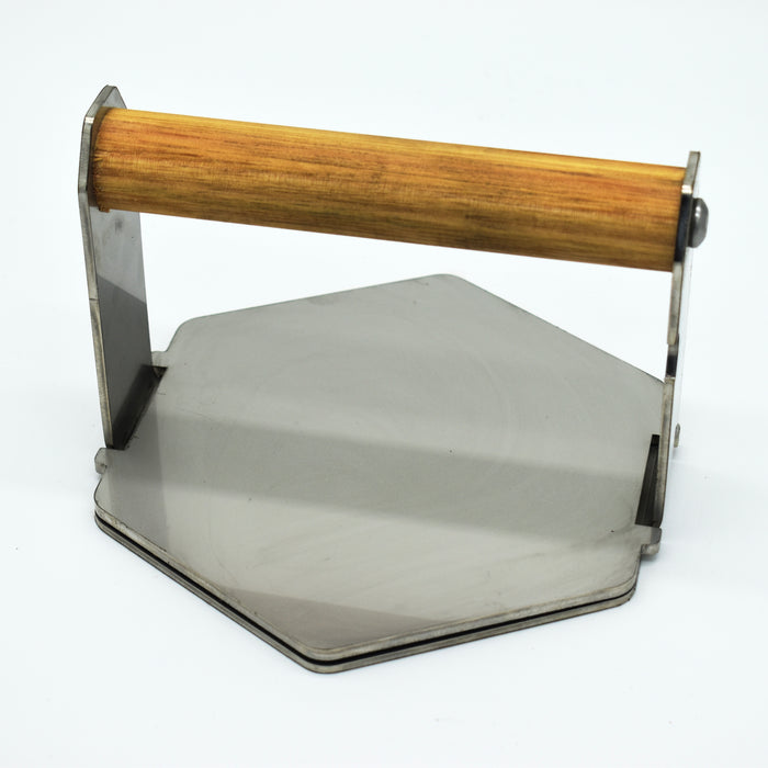 Angle view of steak weight installed into a steak press