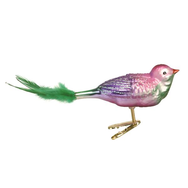 A shiny bird ornament with pink and purple body, green feather tail, and a metallic clip attached to its feet for securing it to surfaces.