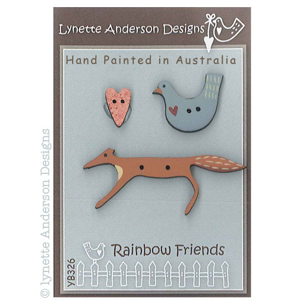 Pack of hand painted wooden buttons designed by Lynette Anderson, including a bird and a fox shape, labeled as 'Rainbow Friends'.