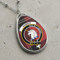 Silver-tone Ramsay teardrop pendant with unicorn crest on tartan background