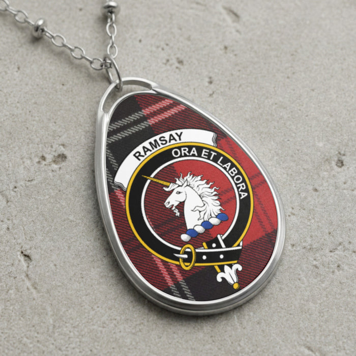 Silver-tone Ramsay teardrop pendant with unicorn crest on tartan background