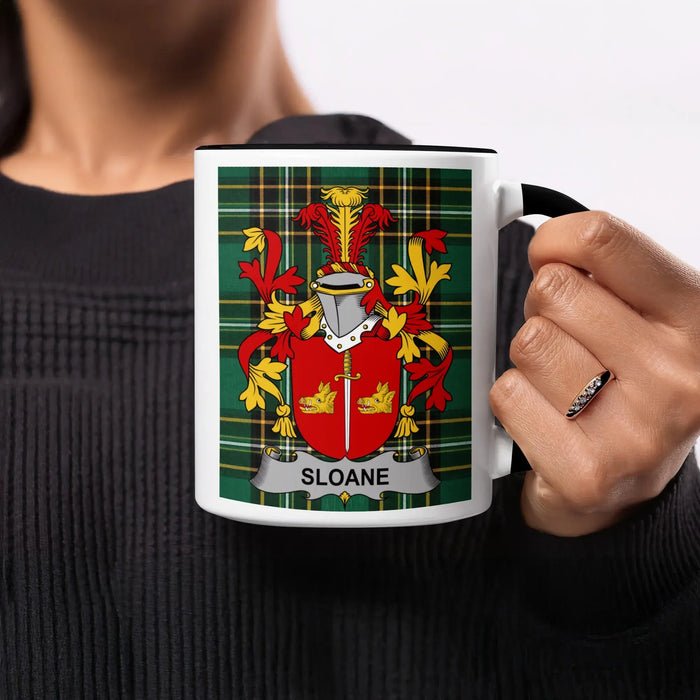 Mug with Sloane family crest on a tartan background.