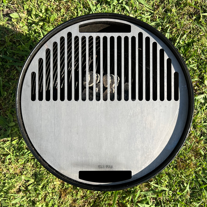 Smokey joe griddle installed with a grass background, top view