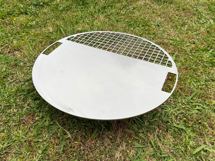 Angled view of the Stainless Plate with green grass background