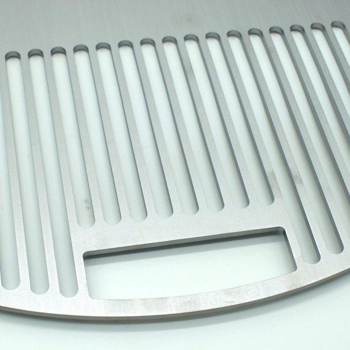 Close up view of the grill and the handle, the handle fits over OEM grill handle
