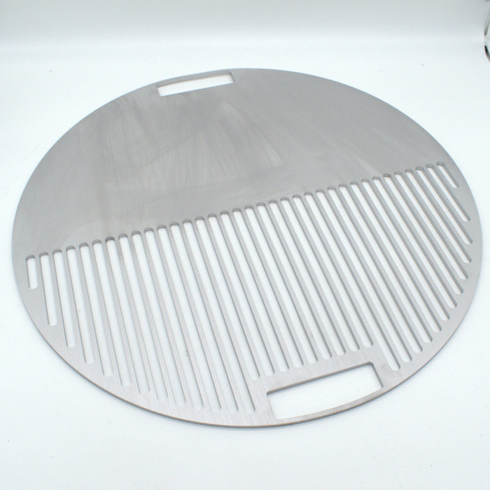 Angled view of the Half Half smash plate, round in shape for cooking over charcoal