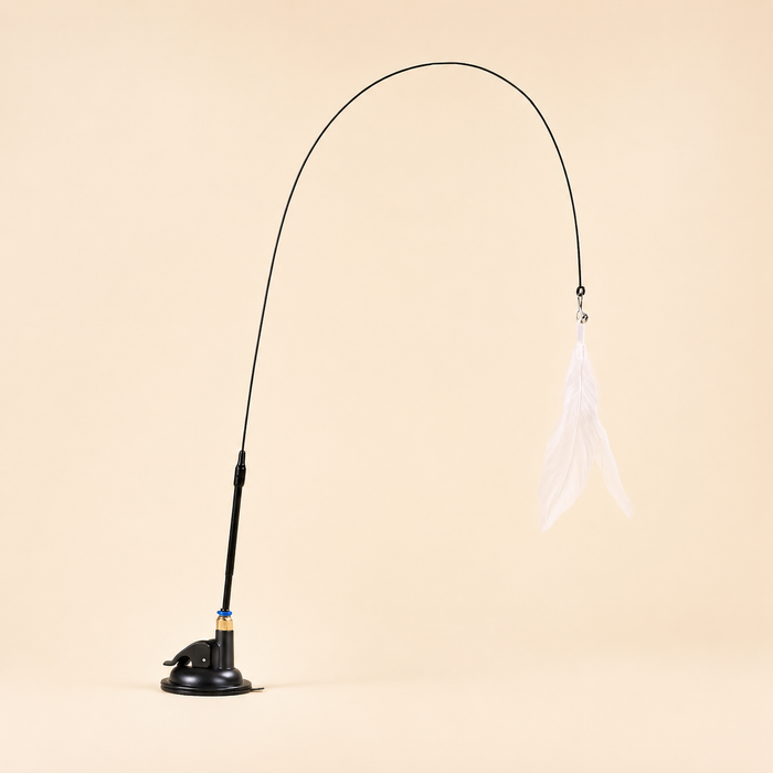 Black Suction Cup Feather Wand with white feather on a warm ivory studio background