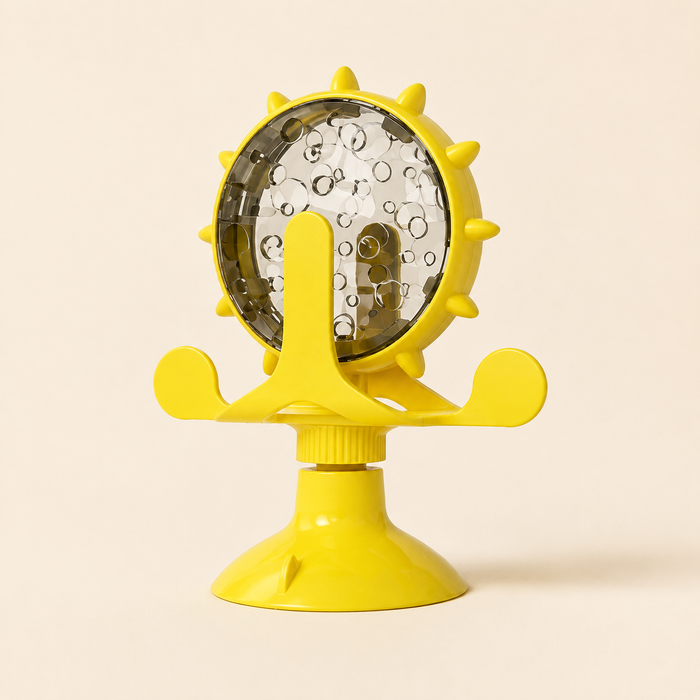Yellow Treat-Dispensing Cat Toy on a warm ivory studio background