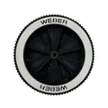 Old school weber genesis wheel inserts installed into a wheel with a white background